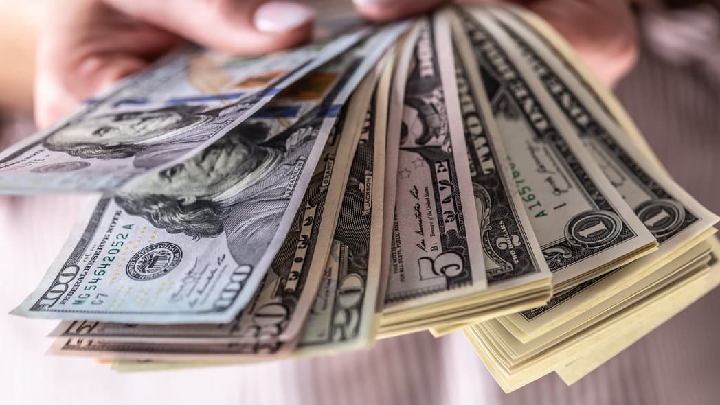 Hands holding money