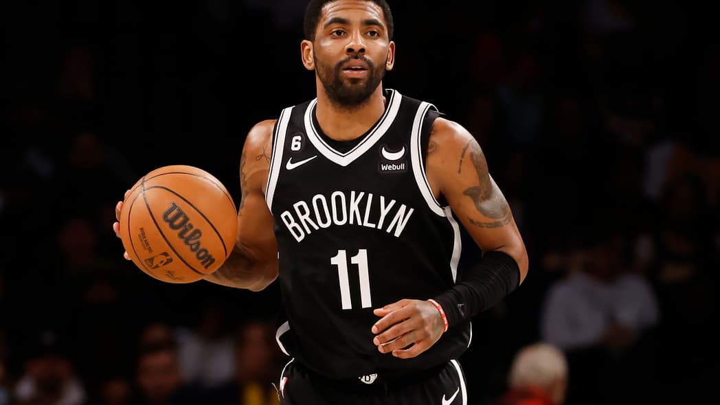 Kyrie Irving of the Brooklyn Nets with a basketball
