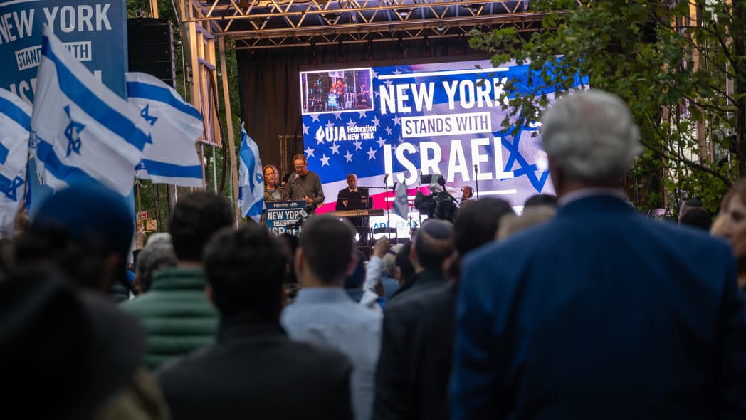 A crowd of people at a 'New York Stands With Israel' vigil and rally