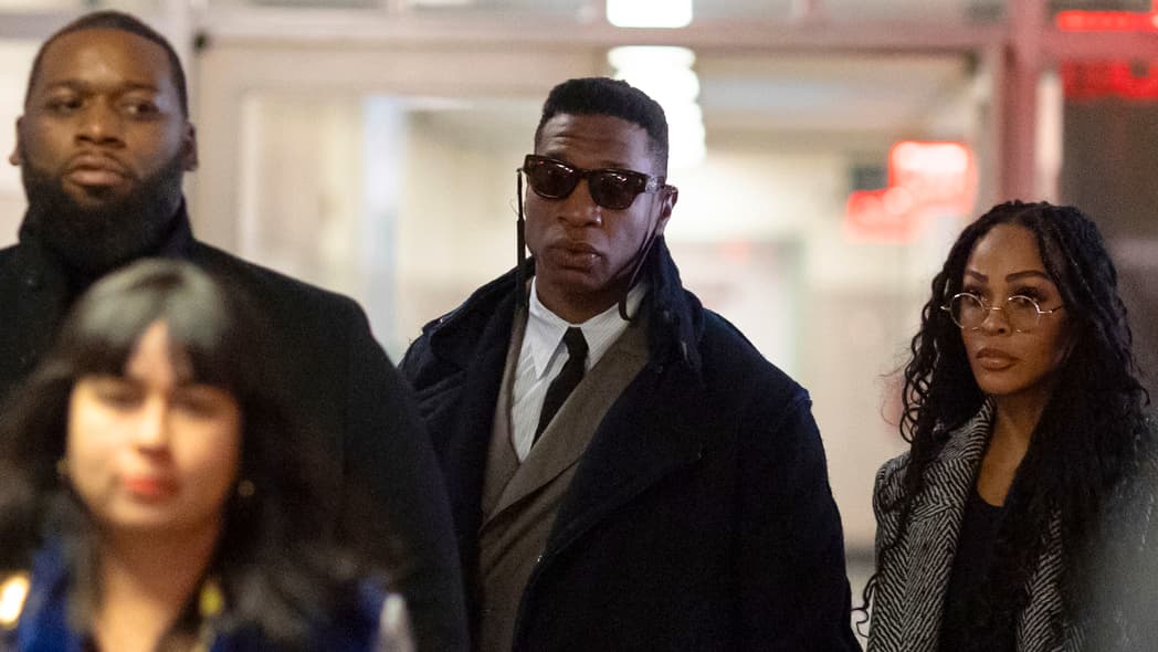 Actors Jonathan Majors, center, and Meagan Good