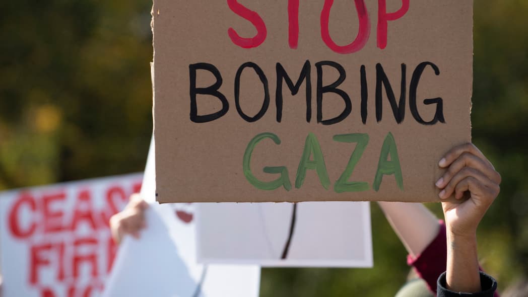 Protesters attend a rally to denounce the Israeli military operations in Gaza