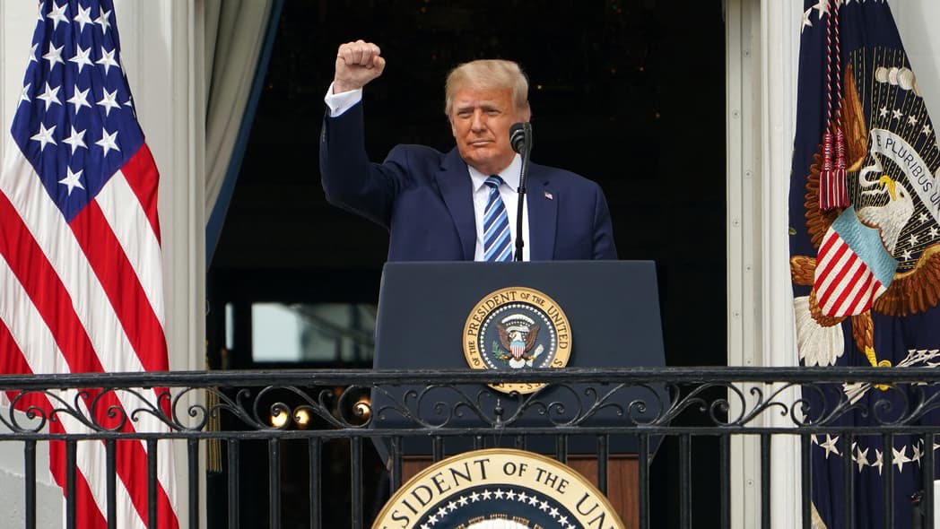 Former President Donald Trump raises a fist