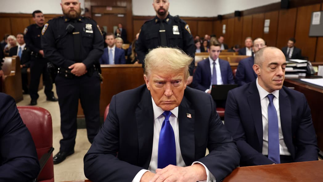 Former President Donald Trump sits at the defense table in Manhattan criminal court