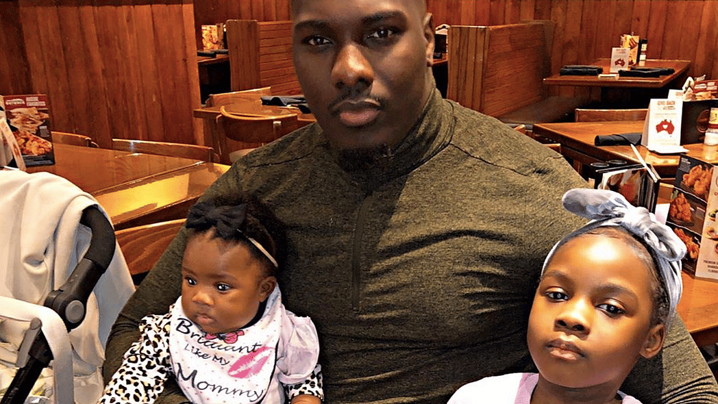 Father and daughters at a restaurant