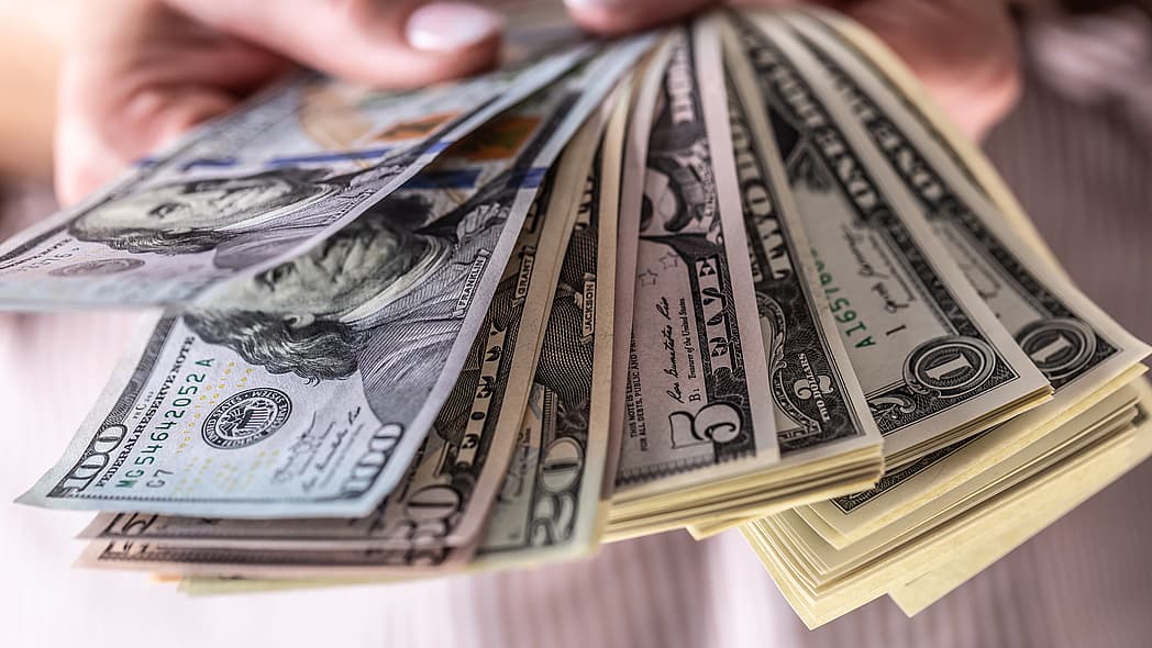 Hands holding money