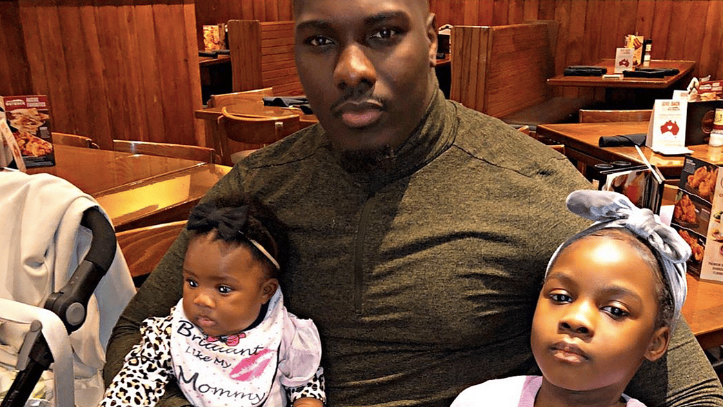 Father and daughters at a restaurant