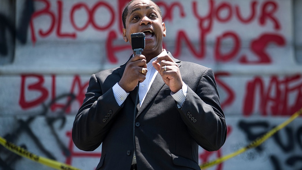 Virginia Lieutenant Gov. Justin Fairfax speaks to demonstrators in front of a statue of Confederate General Robert E. Lee is pictured on June 4, 2020 in Richmond, Virginia.(Photo by Zach Gibson/Getty Images) theGrio.com