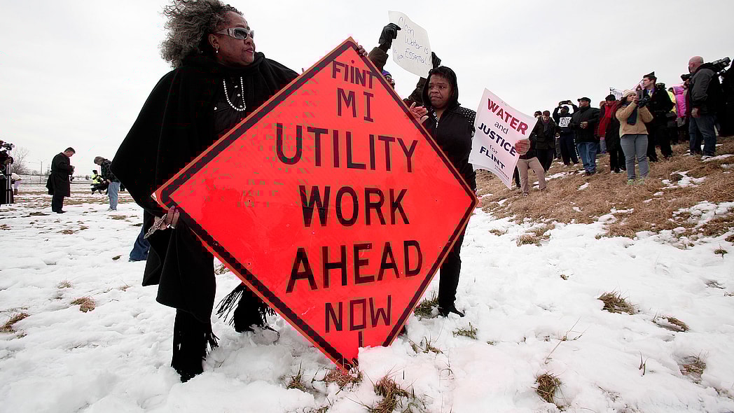 People protest at the Flint Water Plant