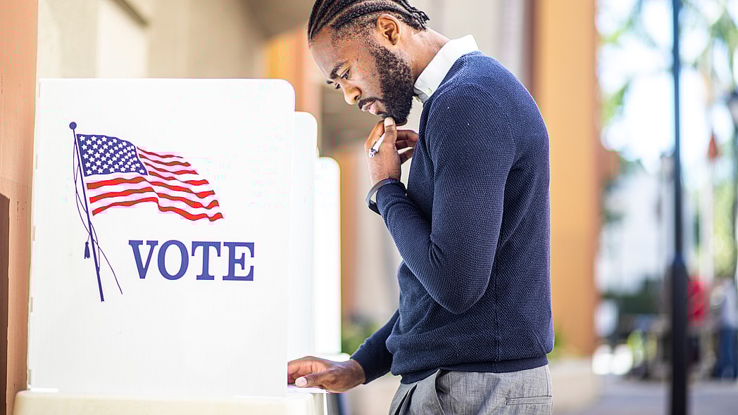Black man voting, theGrio.com