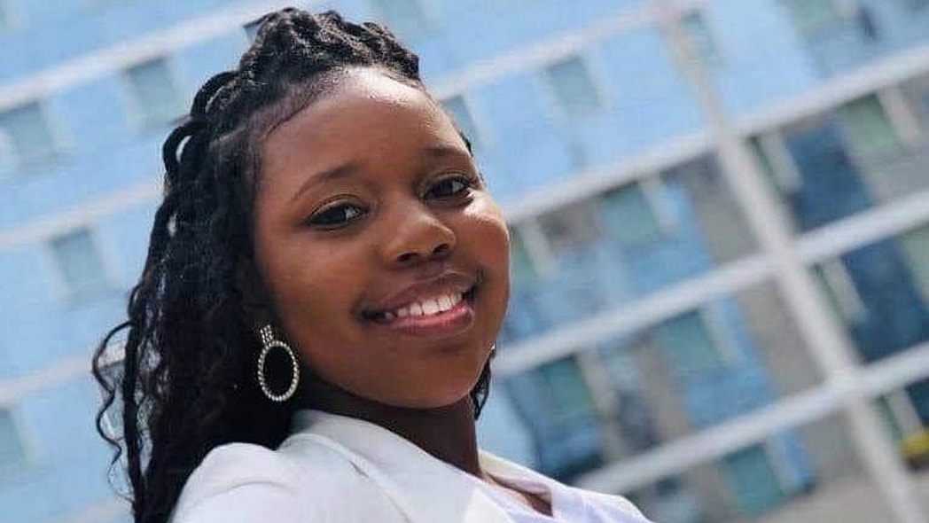 Carlethia “Carlee” Russell smiles, wearing a white top and dangling earrings