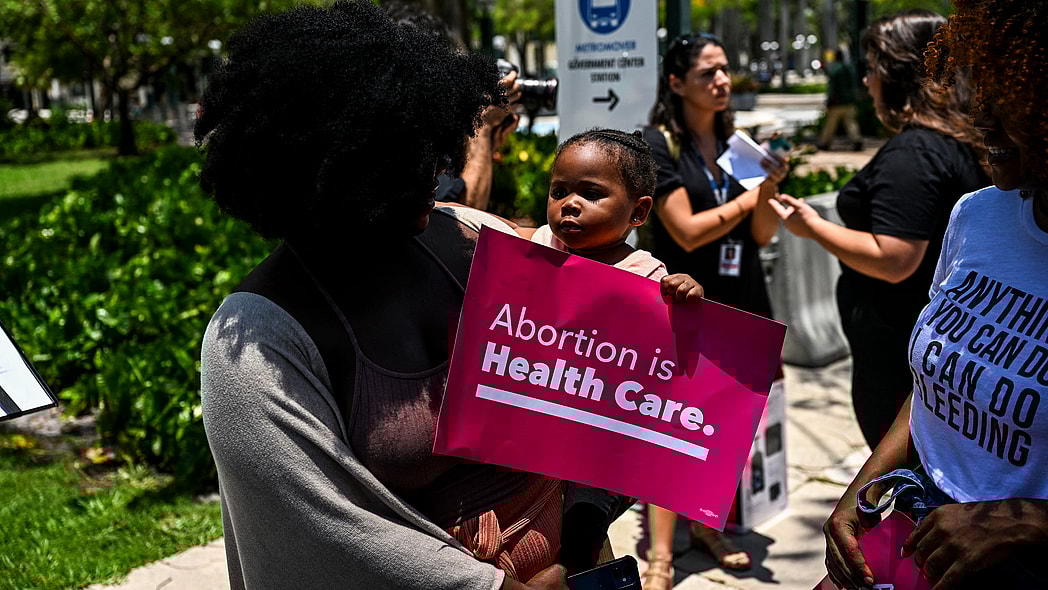 Tifanny Burks holds Novah Smith at an abortion rights protest
