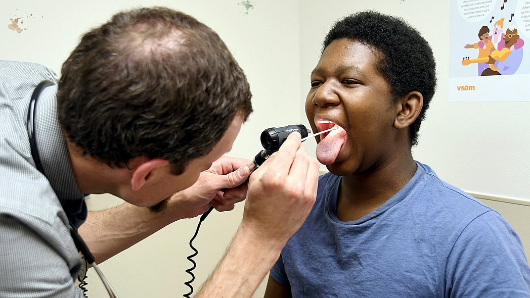 Black child, doctor, vaccines, theGrio.com