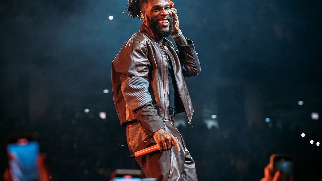 Burna Boy, Burna Boy concert, Burna Boy sleeping fan theGrio.com