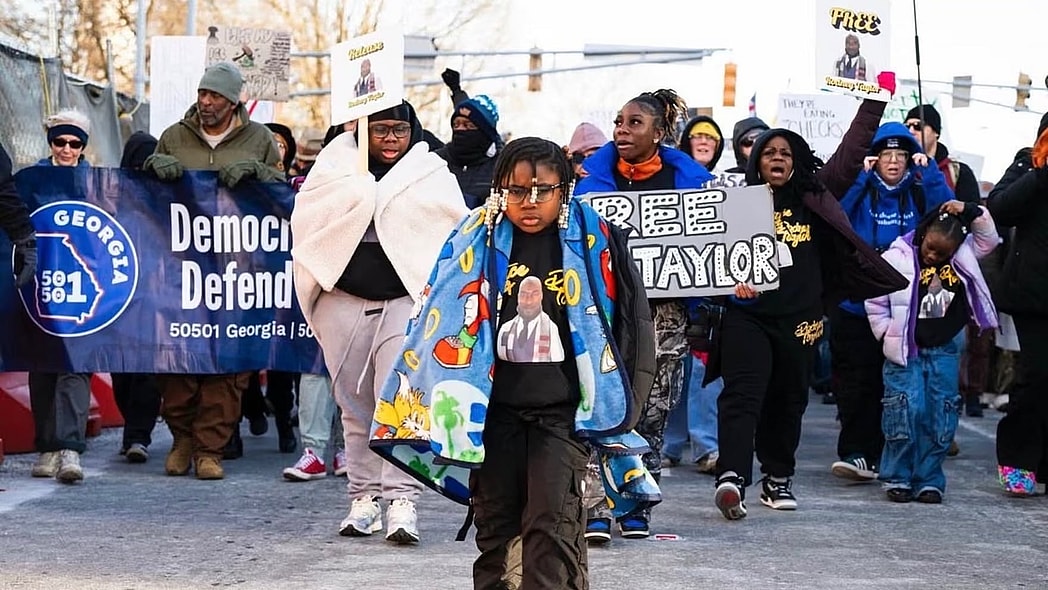 Danis-Taylor’s daughter Aby, seven, with family and marchers behind her in a rally that ended up at Atlanta’s ICE field office, on 1 February. Photograph: Courtesy Mildred Danis-Taylor