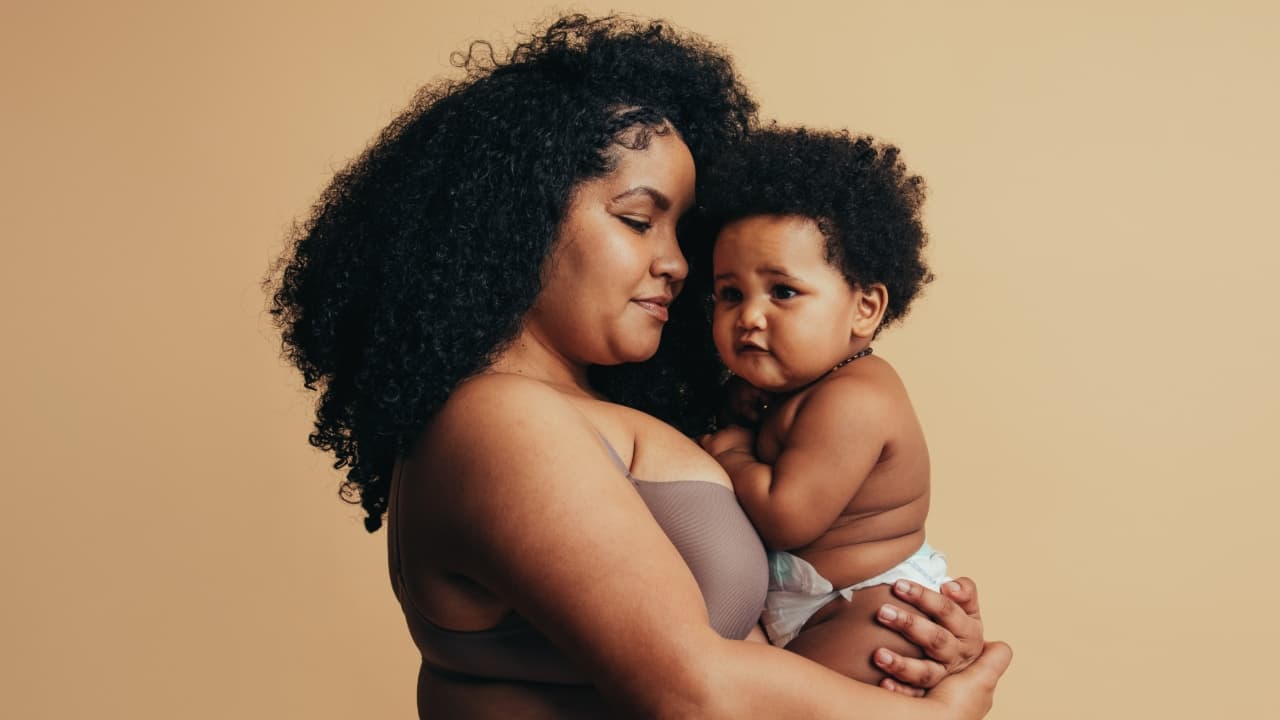 A woman holding a baby