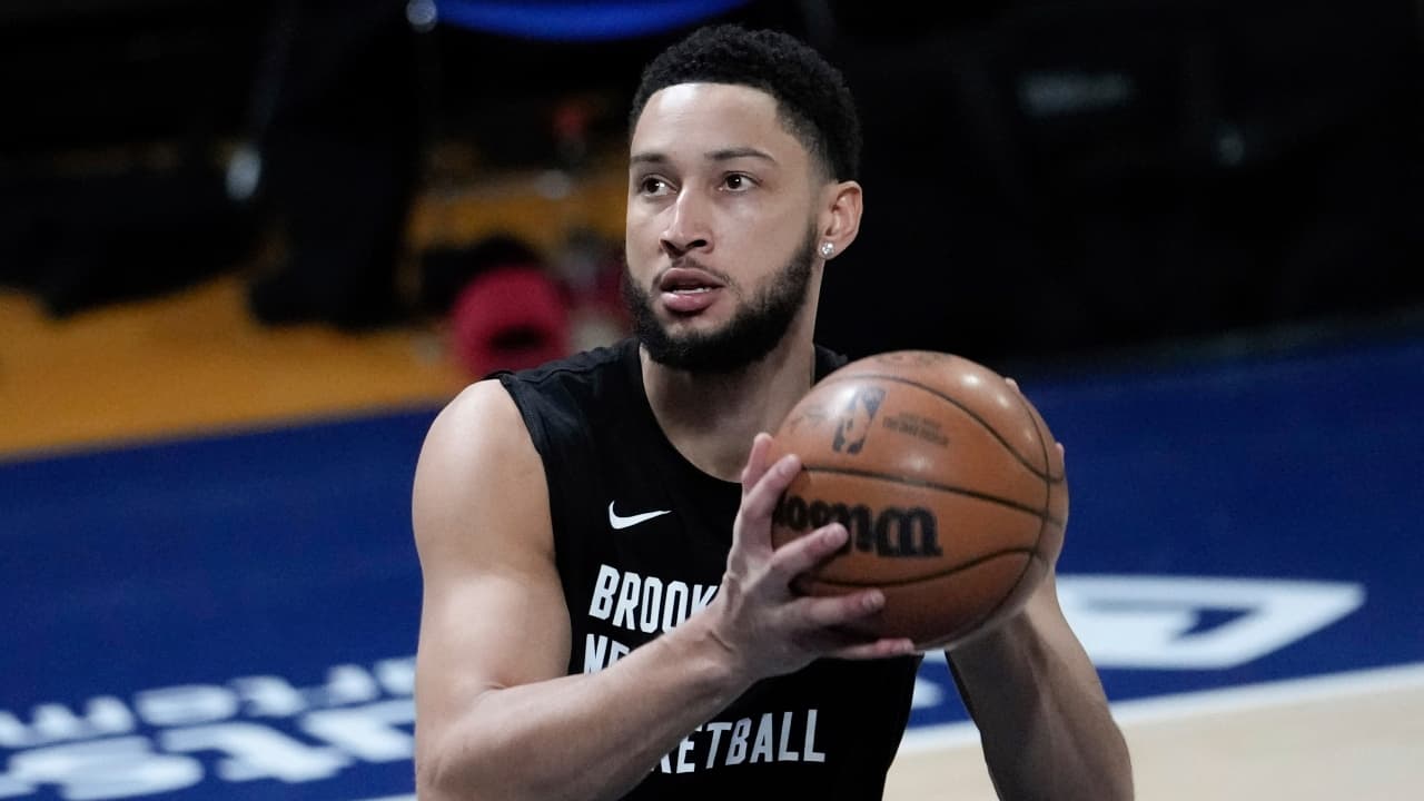 Brooklyn Nets guard Ben Simmons holding a basketball