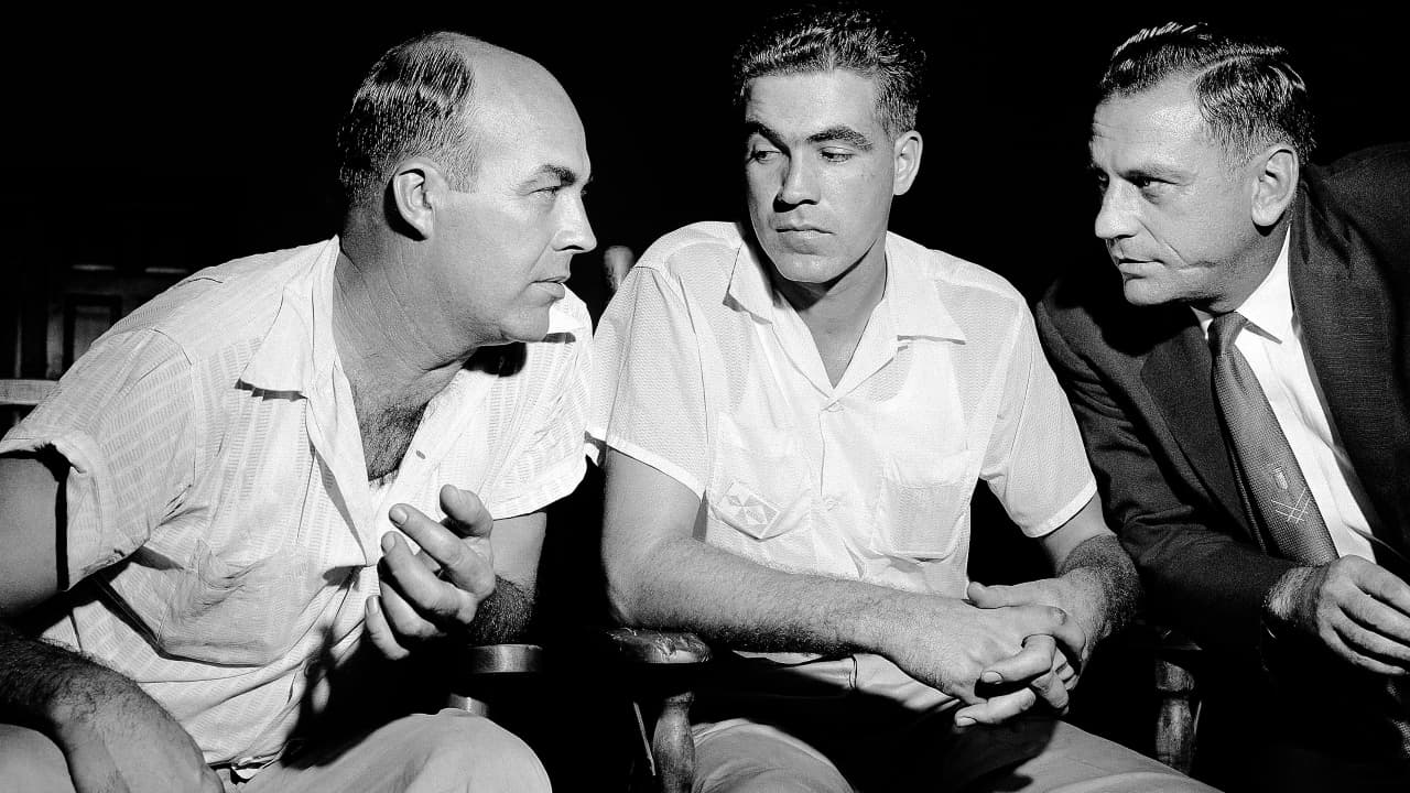 J. W. Milam and half-brother Roy Bryant, accused of killing Emmett Till, confer with lawyer J.W. Kellum
