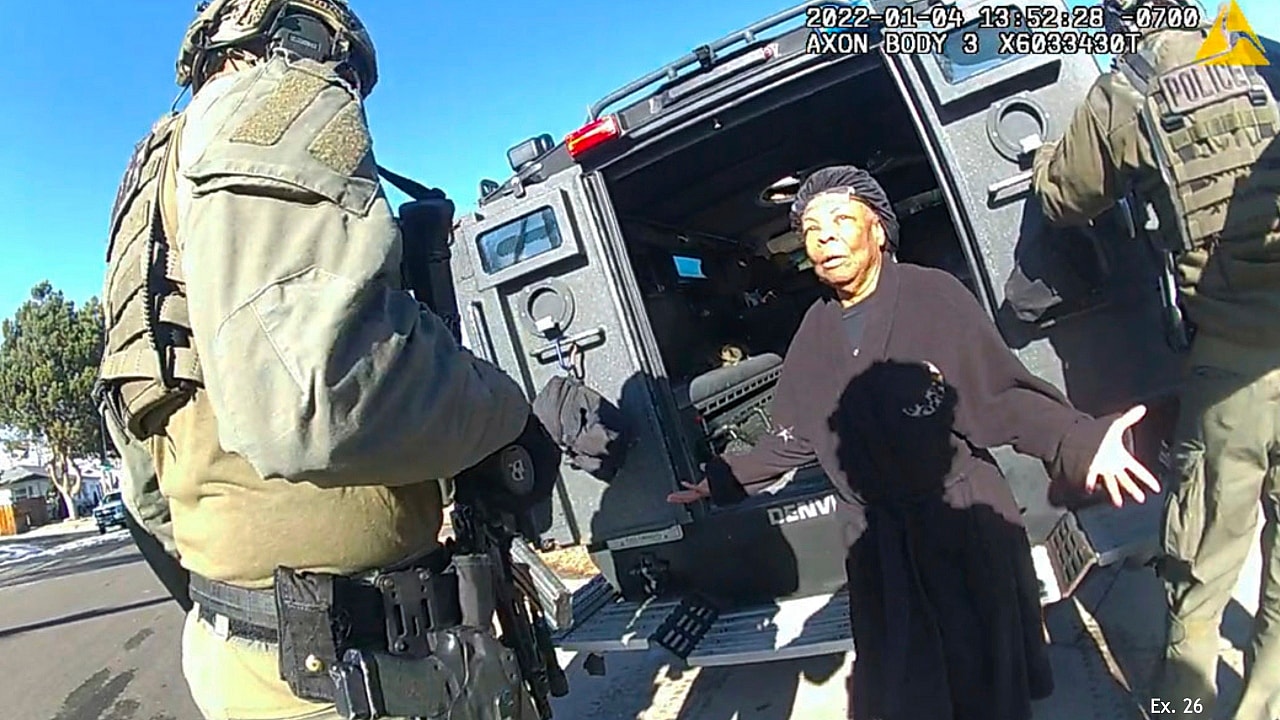 Ruby Johnson surrounded by SWAT officers