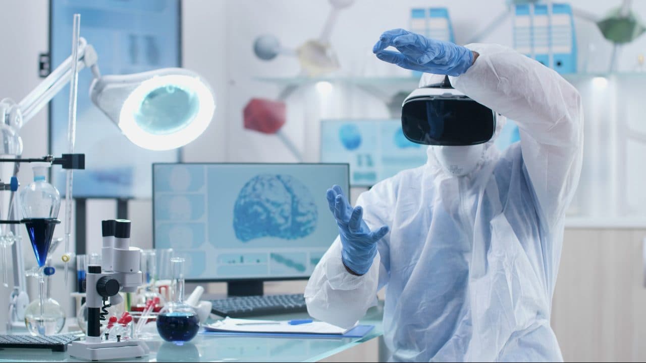 A researcher wearing a hazmat suit in a laboratory