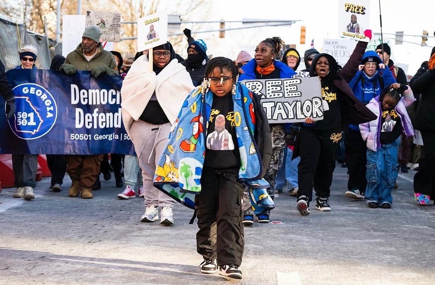 Danis-Taylor’s daughter Aby, seven, with family and marchers behind her in a rally that ended up at Atlanta’s ICE field office, on 1 February. Photograph: Courtesy Mildred Danis-Taylor