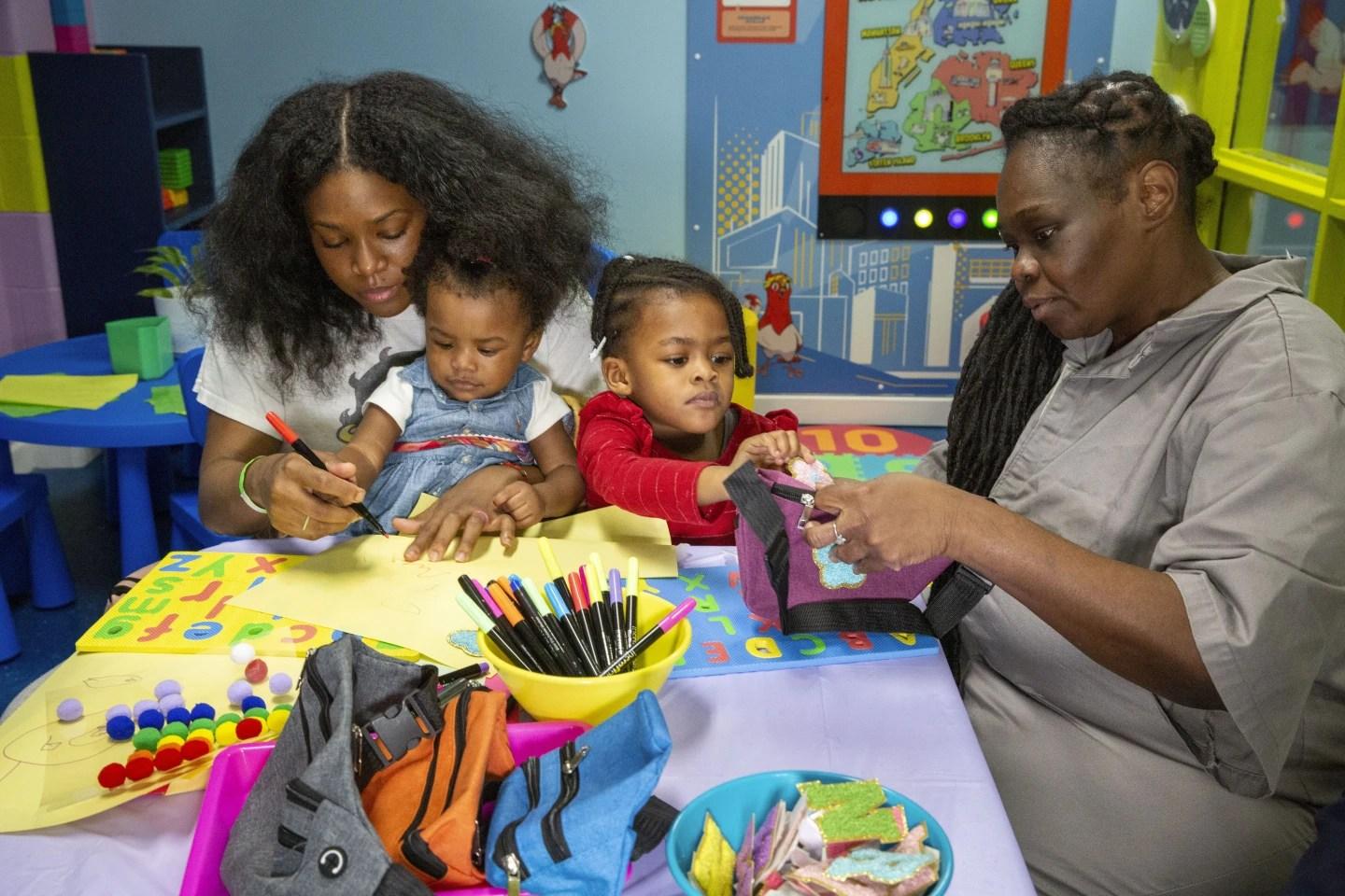 Lashawna Jones and her children visits with her mother, inmate Nadine Leach
