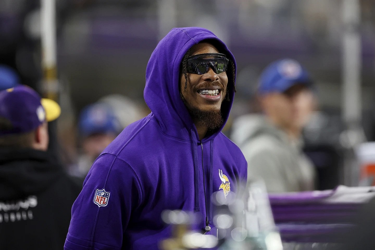 Minnesota Vikings wide receiver Justin Jefferson wearing sunglasses and a purple hoodie