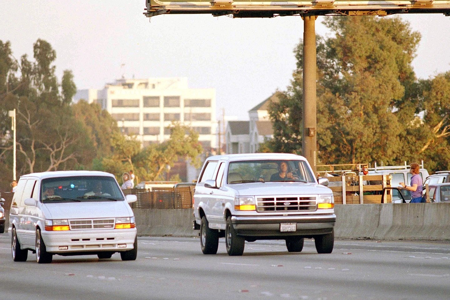 Al Cowlings, with O.J. Simpson hiding, drives a white Ford Bronco as they lead police on a two-county chase