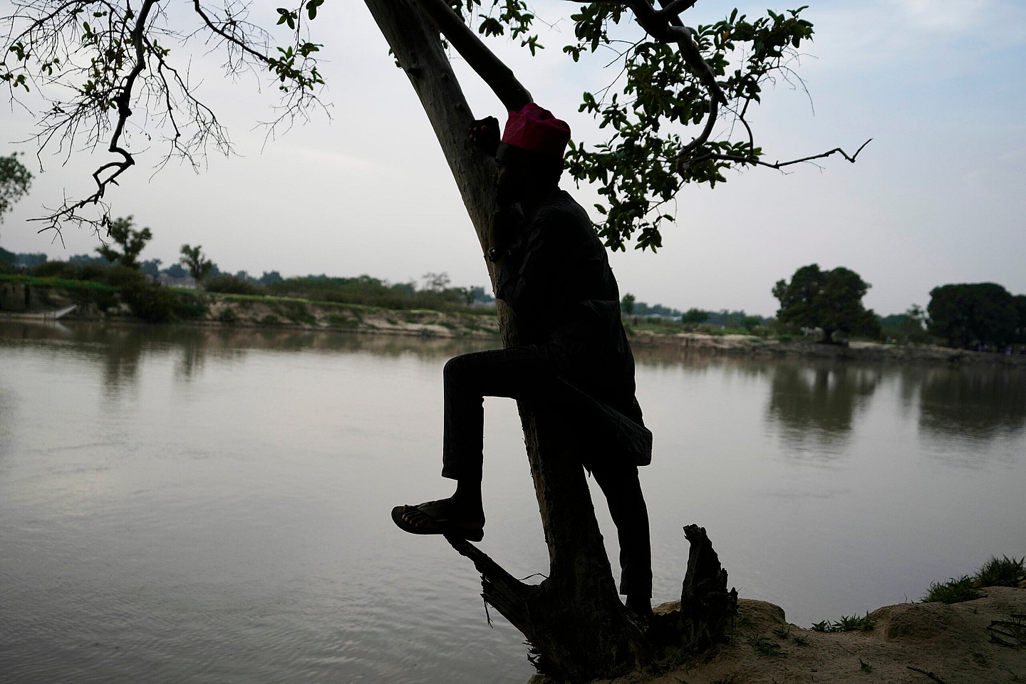 Man stands on the banks of the Yobe river in Nigeria