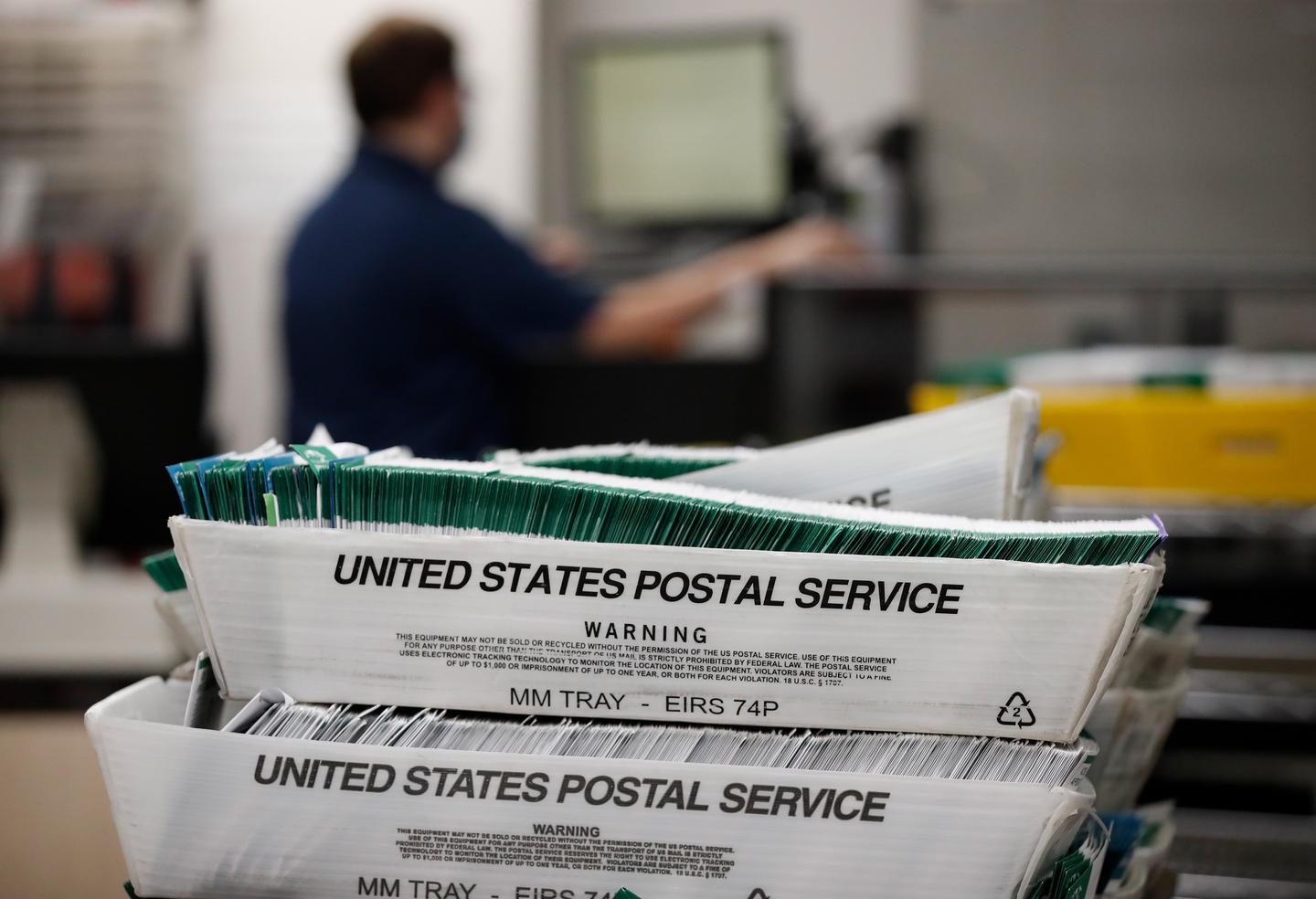 Utah County Election workers stack ballots in the election office that were picked up at a United States Postal Service office to be processed on October 26, 2020 in Provo, Utah. (Photo by George Frey/Getty Images) theGrio.com
