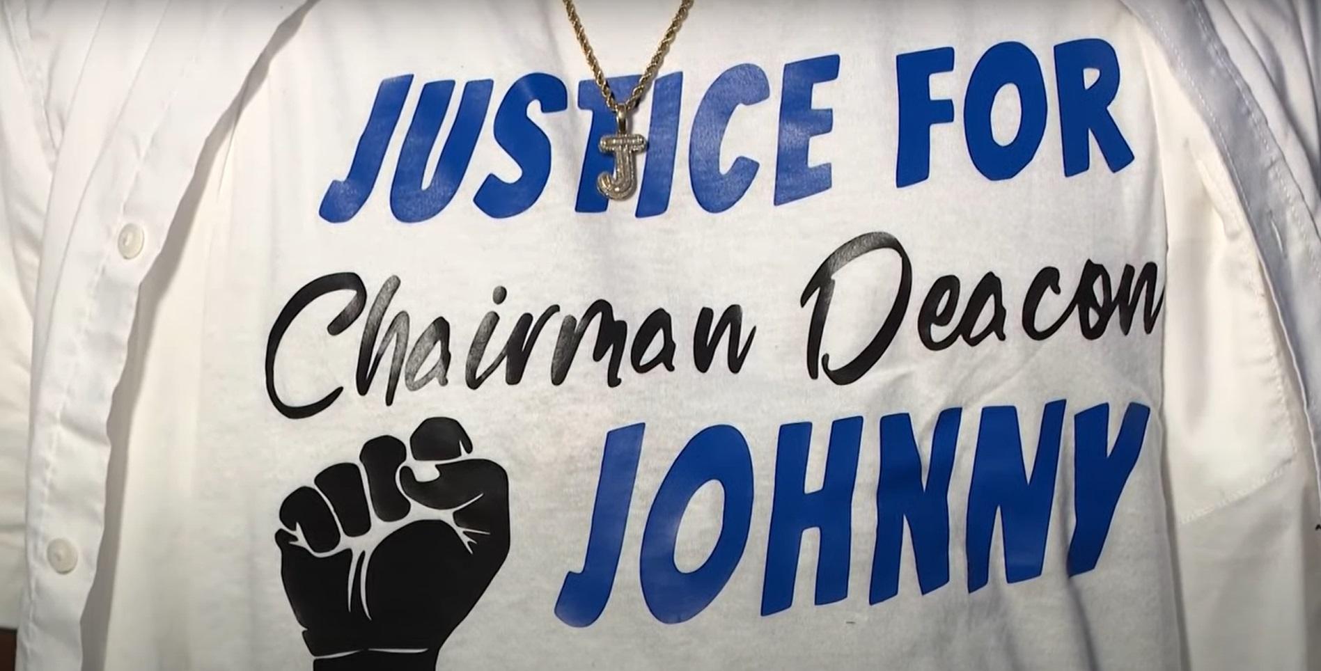 A white jacket bearing the words "Justice for Chairman Deacon Johnny"