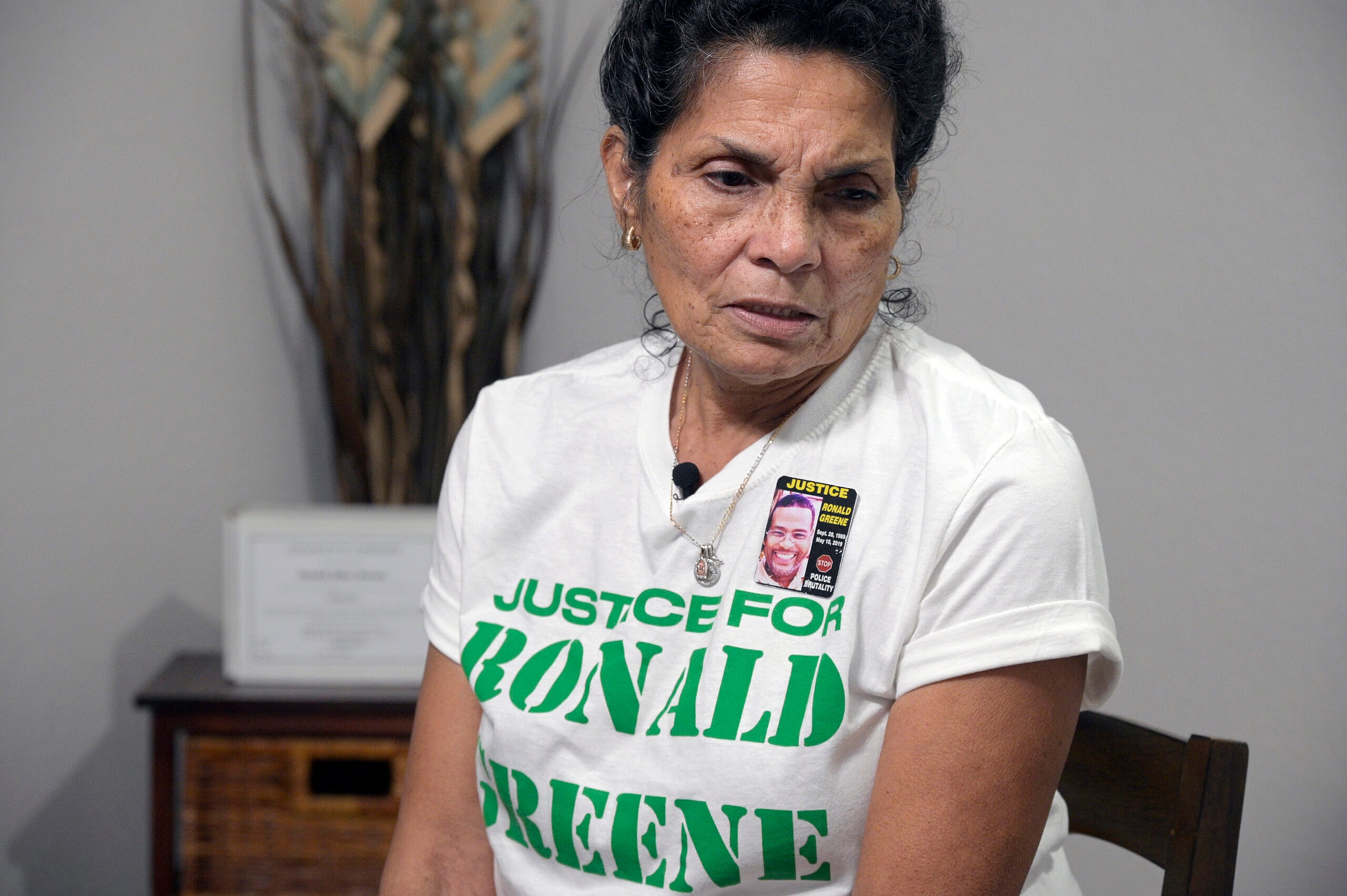 Mona Hardin, mother of Ronald Greene, near his boxed ashes on a table