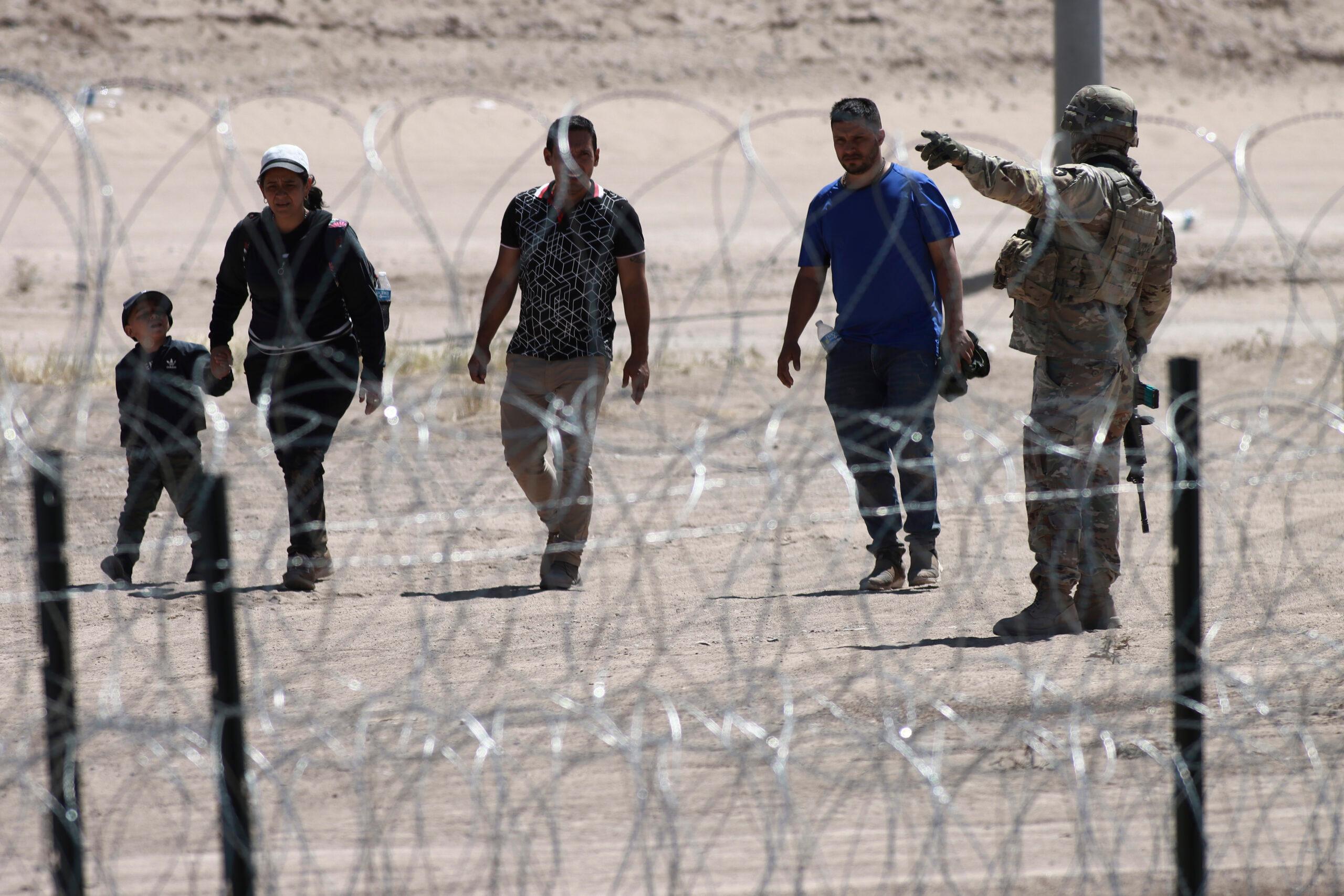 Migrants at the U.S.-Mexico border, theGrio.com