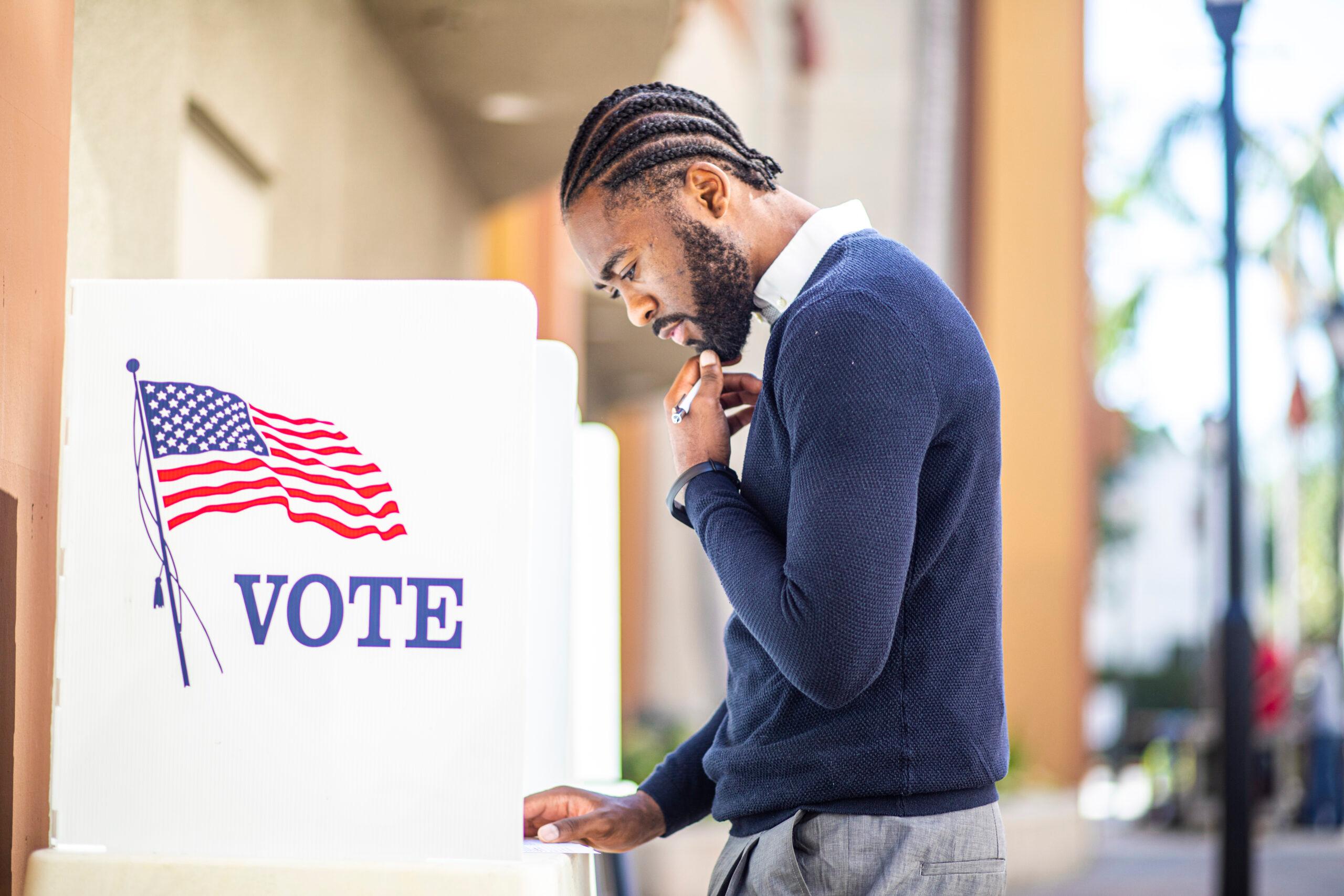 Black man voting, theGrio.com