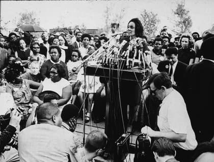 American civil rights campaigner, and widow of Dr. Martin Luther King Jr., Coretta Scott King (1927 - 2006) addresses the assembled crowd during the 'Poor People's March,' Washington, DC, 1968. The March to spotlight the needs of the impoverished began in Mississippi on April 22d and arrived in Washington on May 14th. The participants camped downtown and demonstrated every day until June 24th. (Photo by Hulton Archive/Getty Images) thegrio.com