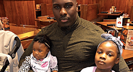 Father and daughters at a restaurant