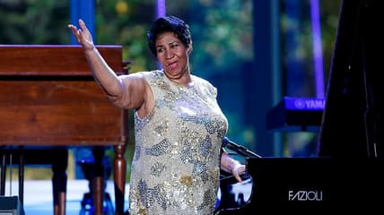 Aretha Franklin waves after her performance at the International Jazz Day Concert (Photo by Aude Guerrucci-Pool/Getty Images)