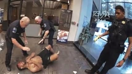 Tulsa police tase Joshua Harvey multiple times in bank. (Tulsa Police video) thegrio.com