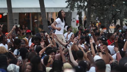 People enjoy themselves along Ocean Drive in Miami Beach, Florida