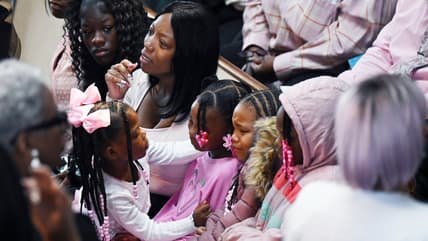 Tateona Williams, A'millah Currie, 2, and Darnell Currie, Jr., theGrio.com