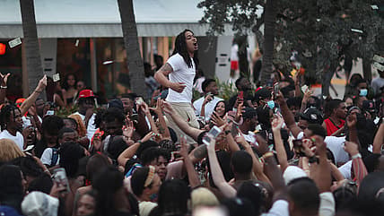 People enjoy themselves along Ocean Drive in Miami Beach, Florida