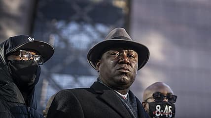 In this Monday, March 29, 2021 file photo, from left, Terrence Floyd, brother of George Floyd; attorney Ben Crump and Philonise Floyd, brother of George Floyd, hold a news conference at the Hennepin County Government Center in Minneapolis, Minn., on the first day of the Derek Chauvin murder trial. (Jerry Holt/Star Tribune via AP) theGrio.com