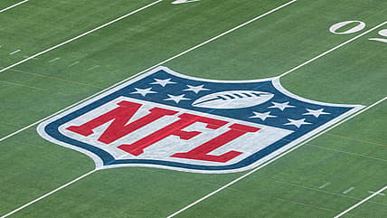 The NFL logo on a football field
