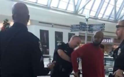 Ro Lockett was handcuffed by Frisco police after being accused of stealing from a Frontline store. (Ro Lockett/Facebook) thegrio.com