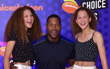 SANTA MONICA, CA - JULY 19: Former NFL player Michael Strahan (C) and daughters, Isabella Strahan and Sophia Strahan attend Nickelodeon Kids' Choice Sports Awards 2018 at Barker Hangar on July 19, 2018 in Santa Monica, California. (Photo by Rodin Eckenroth/FilmMagic) thegrio.com