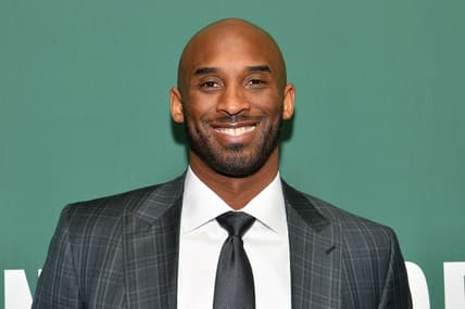 Kobe Bryant Signs Copies Of His Book "Training Camp (The Wizenard Series #1)"