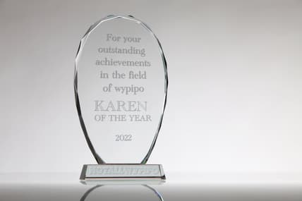 A clear acrylic award reading "For your outstanding achievements in the field of wypipo, Karen of the Year 2022"