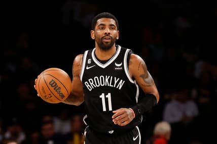 Kyrie Irving of the Brooklyn Nets with a basketball