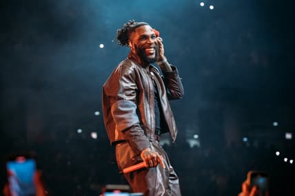 Burna Boy, Burna Boy concert, Burna Boy sleeping fan theGrio.com