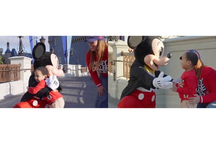 Mickey Mouse and a fan at Magic Kingdom