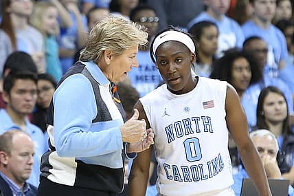 16 November 2014: UNC head coach Sylvia Hatchell (left) talks with Jamie Cherry (0). The University of North Carolina Tar Heels hosted the University of California Los Angeles Bruins at Carmichael Arena in Chapel Hill, North Carolina in a 2014-15 NCAA Division I Women's Basketball game. UNC won the game 84-68. (Photo by Andy Mead/YCJ/Icon Sportswire/Corbis via Getty Images) thegrio.com